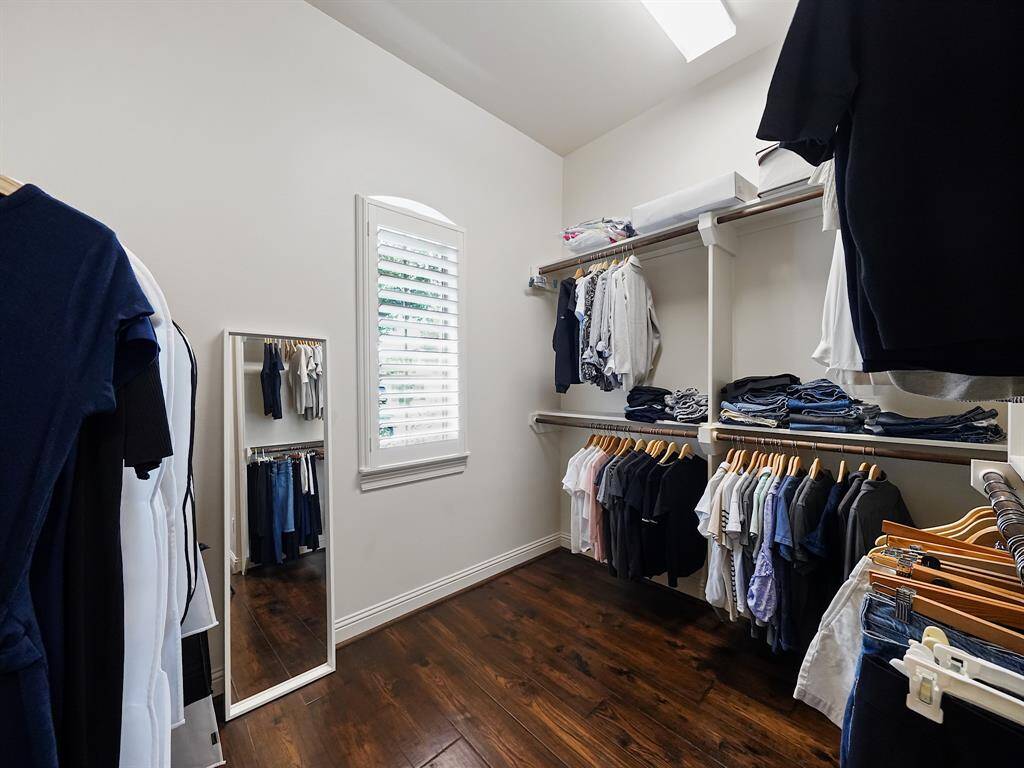 Primary retreat features a truly impressive, oversized walk-in closet. Storage solutions abound, allowing you to organize your belongings with ease and maximize your living space.