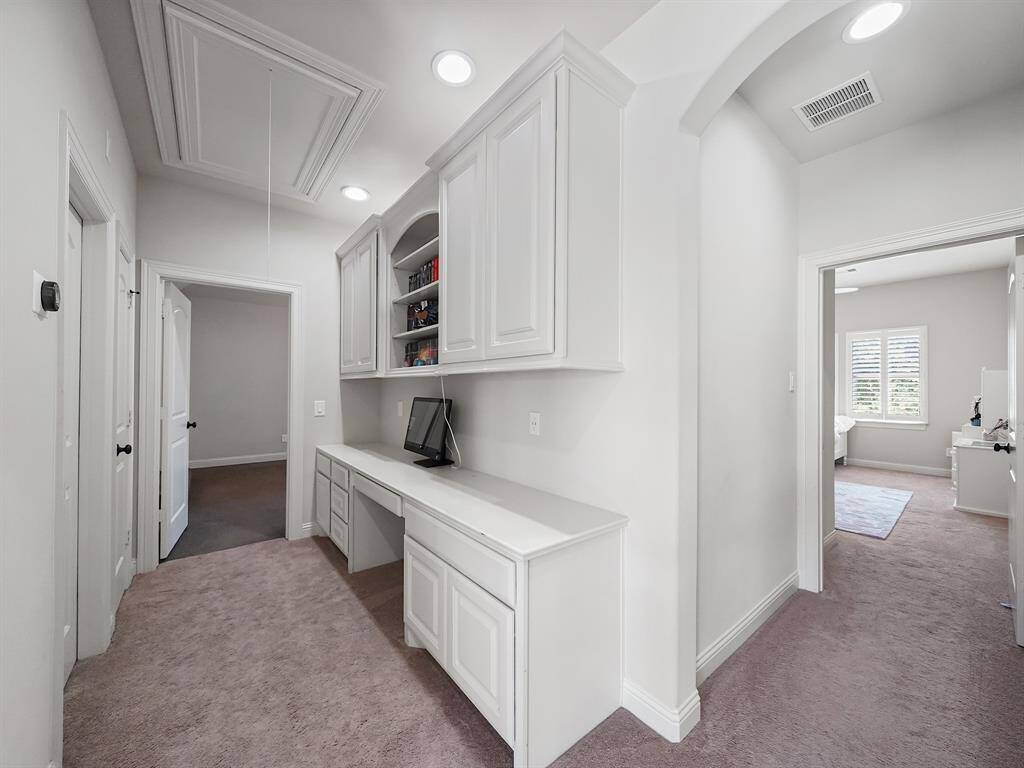 Enhancing the functionality of this property is a thoughtfully designed study nook, conveniently situated just outside the game room. This quiet and functional space is perfect for students requiring a focused area for homework or professionals seeking a secondary workspace.