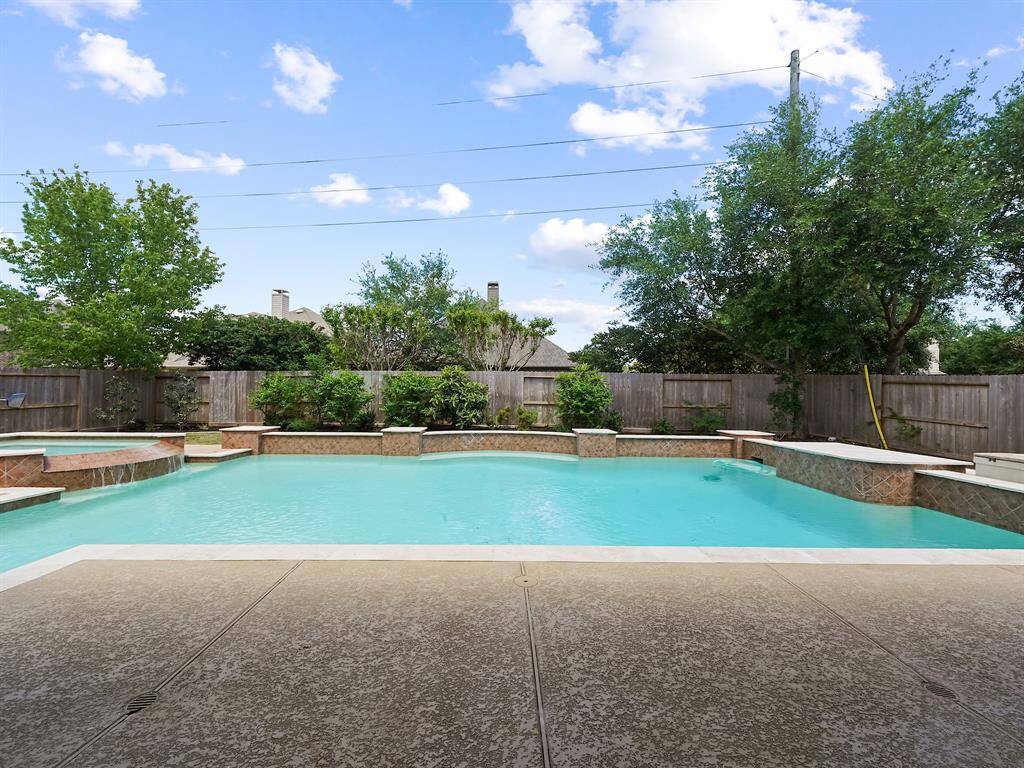 Imagine relaxing poolside in your own private sanctuary. This exceptional property features a gorgeous heated pool and spa complemented by beautifully manicured landscaping. Escape the everyday and embrace tranquility.