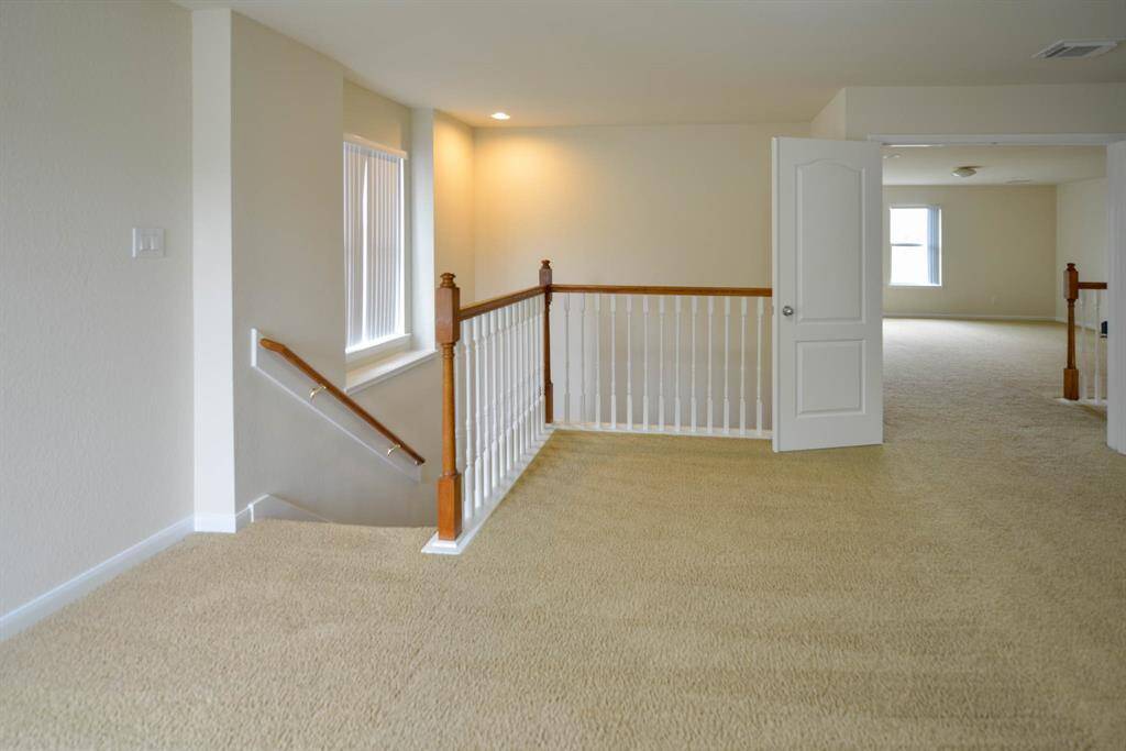 The upstairs study offers private access to the owner's bedroom and opens to the game room, providing versatile living options.