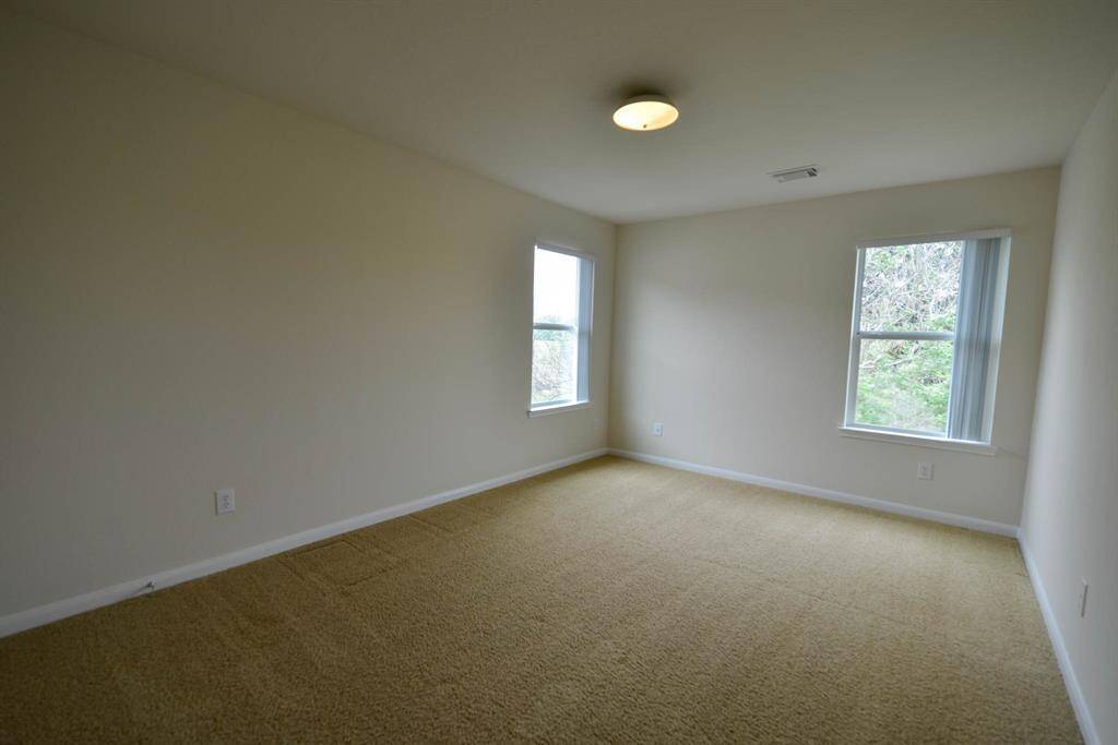 Spacious bedroom ideal for children's comfort and play.