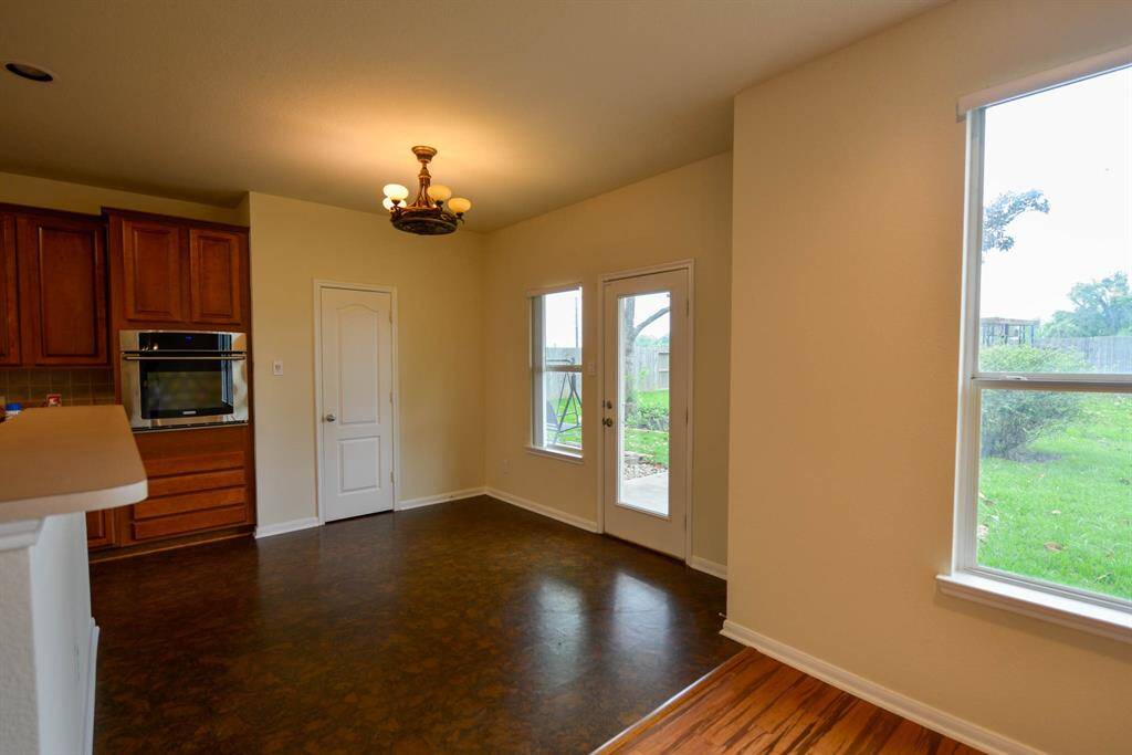 Discover a versatile breakfast room featuring a convenient breakfast bar, seamlessly flowing into the dining or sitting area for effortless entertaining.