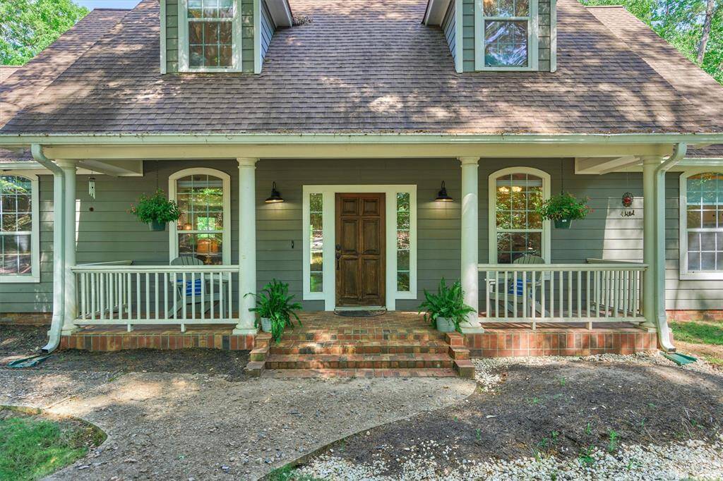 The front porch is a great place to sit, listen to birds sing, enjoy the breeze, and appreciate nature!