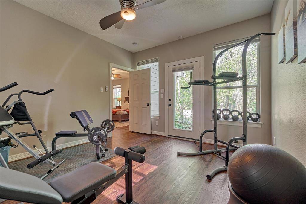 This room is located just off of the primary suite and provides access to the back deck.  While currently being used as a weight room, it would also make a great second study or sunroom!
