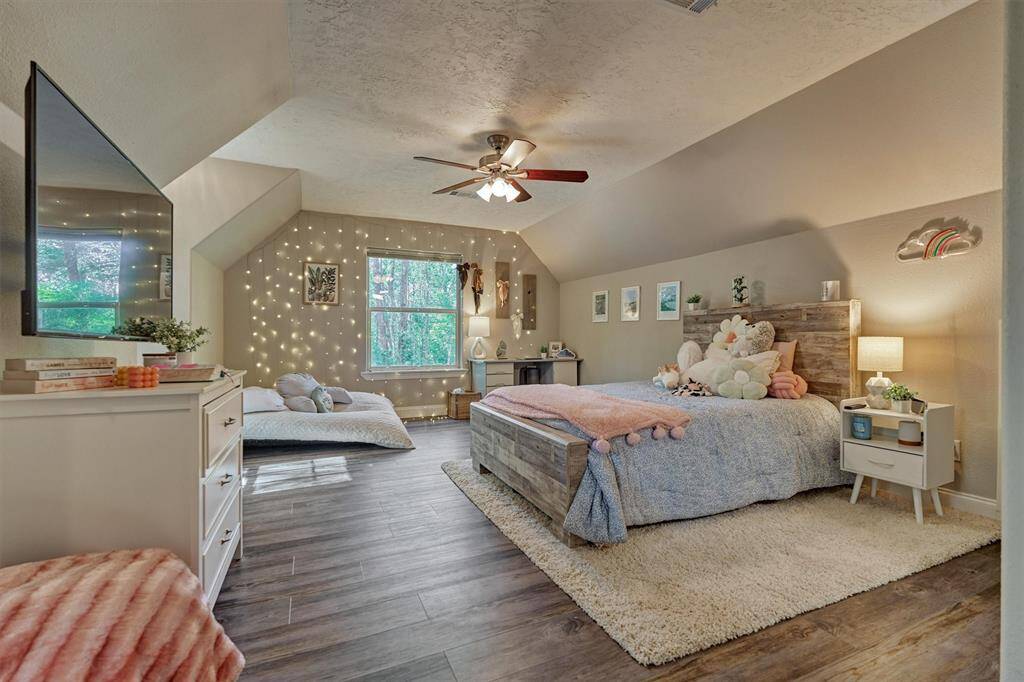 Accessed from the back staircase, this large space is currently being used as a bedroom, but would also be a great game or media room!