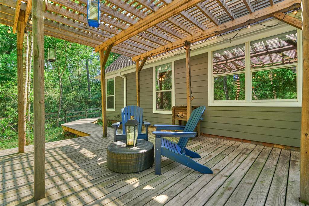 Sitting under the pergola is a great spot to enjoy views of the pool!