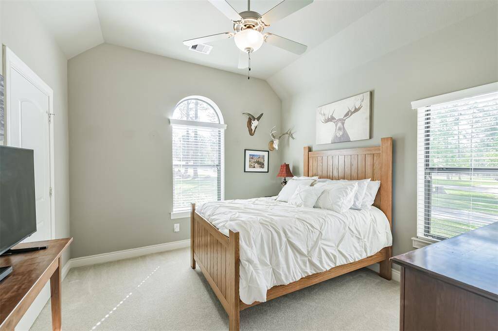 This bedroom has lots of natural light and a walk in closet.