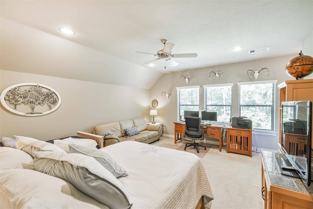 This spacious flex room is filled with natural light and offers a beautiful view, making it perfect for a home office, media room, workout space, or guest retreat. It also provides convenient access to a walk-in attic with generous built-in storage.