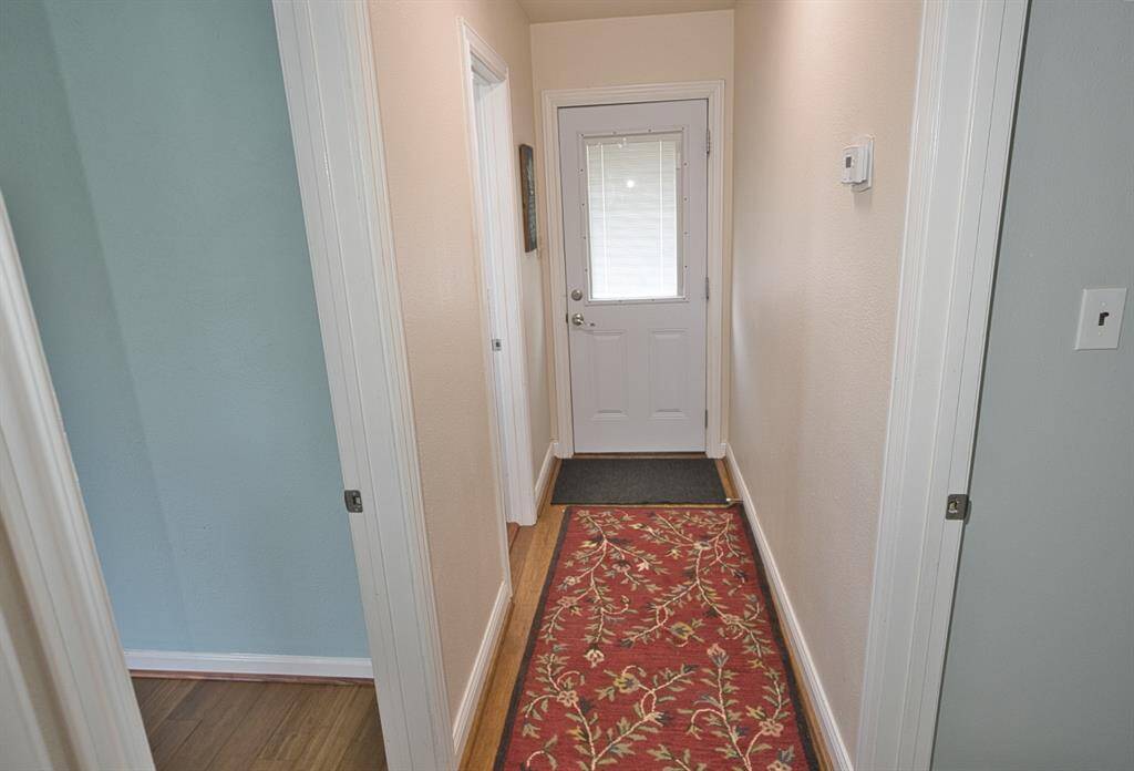 Hall on the opposite side of the home just past the Kitchen