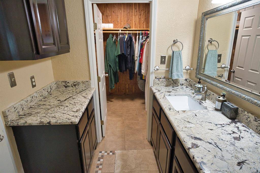 Adjacent Bath features aCedar Lined Walk-in Closet