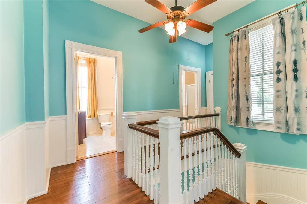 2nd set of stairs leading to both of the upstairs bathrooms.