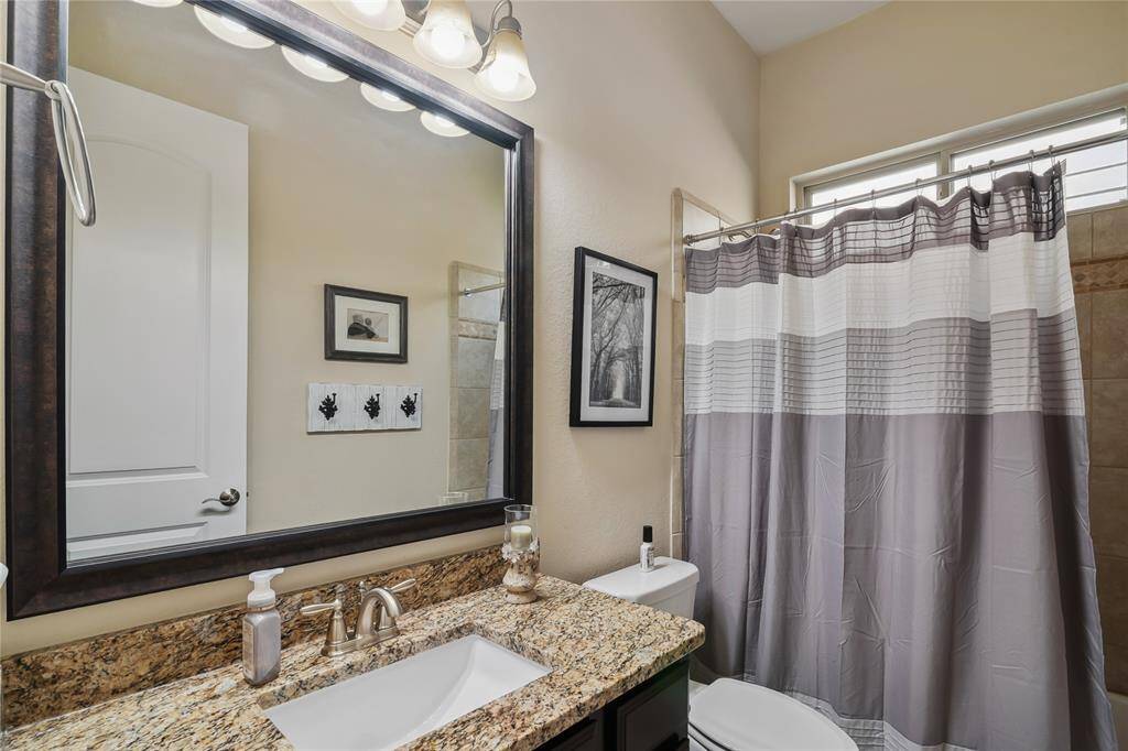 Down Stairs Full Bath with granite counter top, tub and shower.