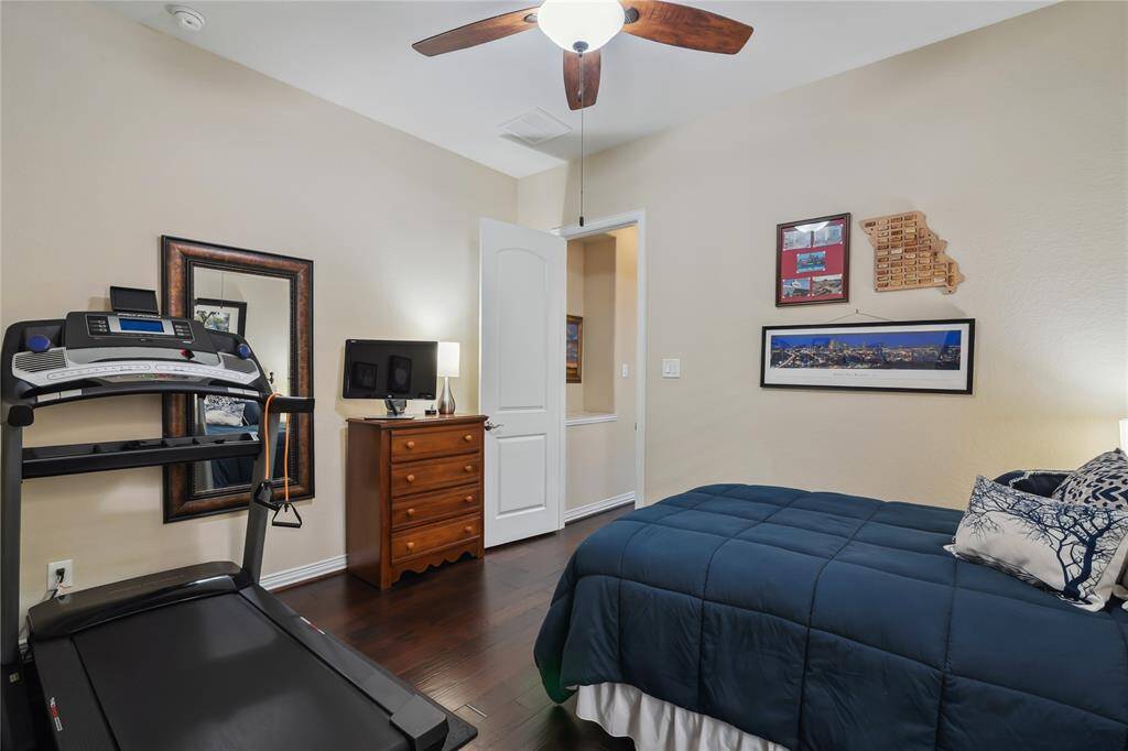 Down Stairs Bedroom large enough for walk in closet, furniture and treadmill.
