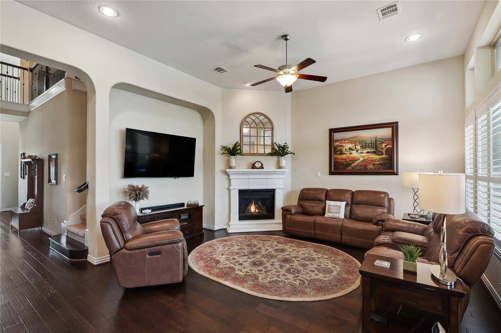 Wow! This family room is absolutely perfect! Beautiful fireplace, large windows and niche for TV.  It just doesn't get any better than this.