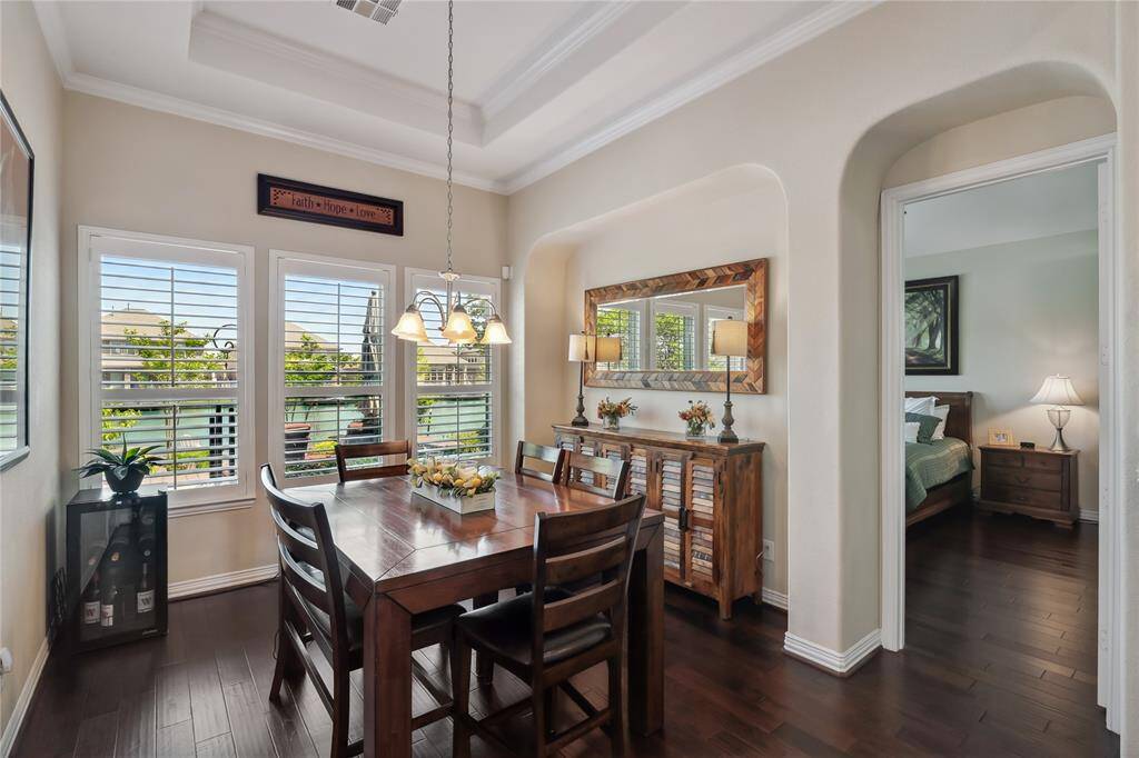 Dining Room is open and bright.  Plantation shutters throughout, amazing views of the water and so much more.