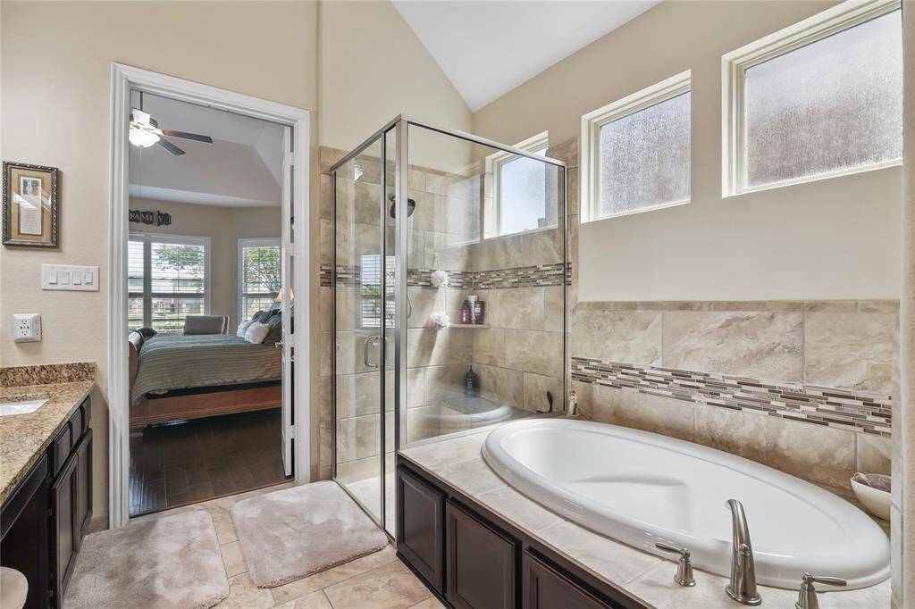 Primary suite bathroom is simply gorgeous and functional.