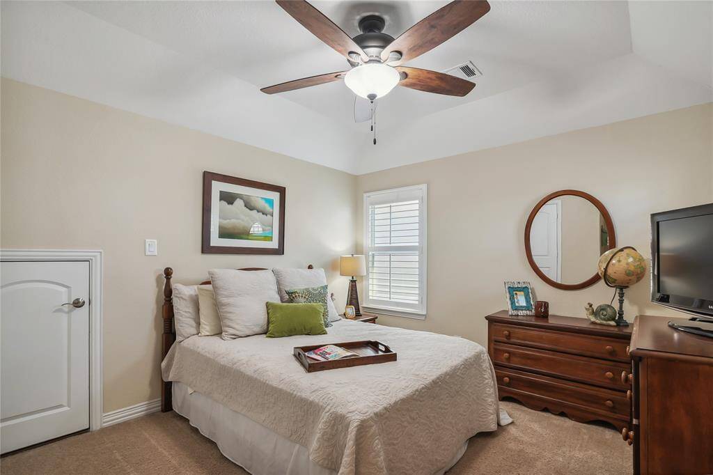 Large upstairs bedroom with attic access.