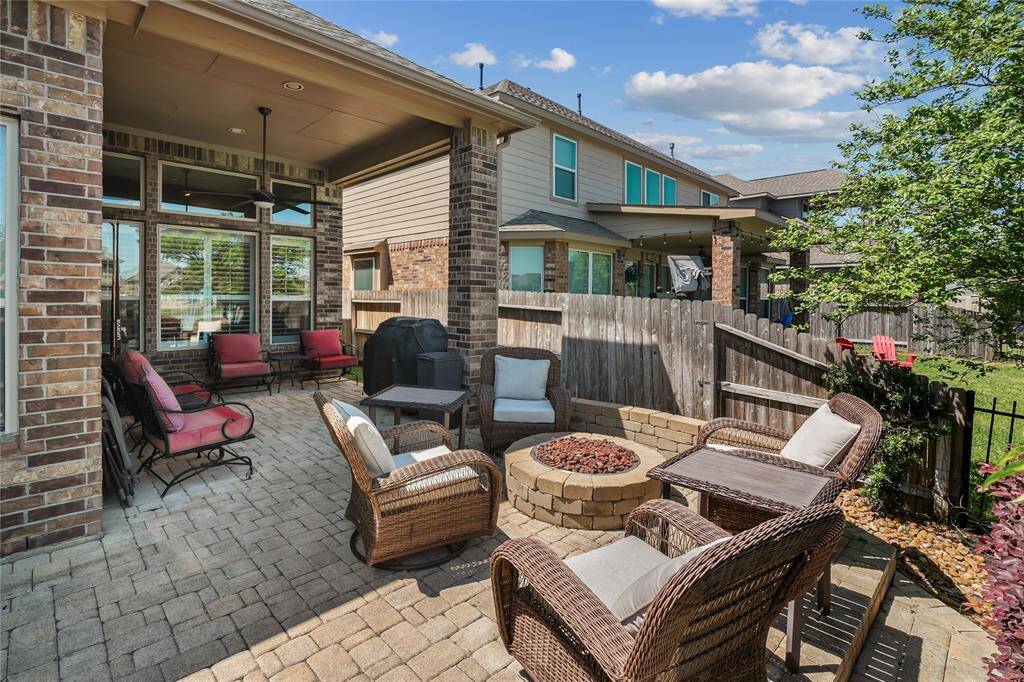 Fire Pit and Covered Porch Sitting Area.  Perfect for relaxing with friends and family.