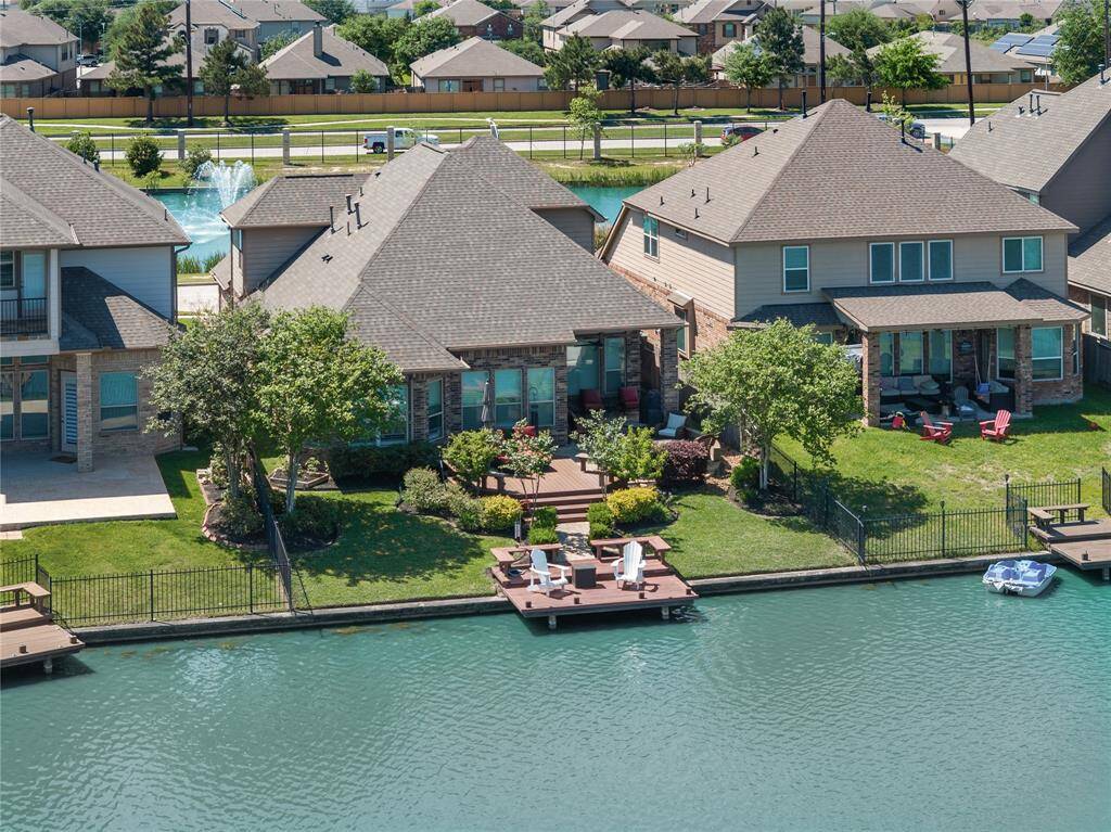 Aerial Shot of the custom designed Backyard with three sitting areas. You will feel like you are on vacation year round.