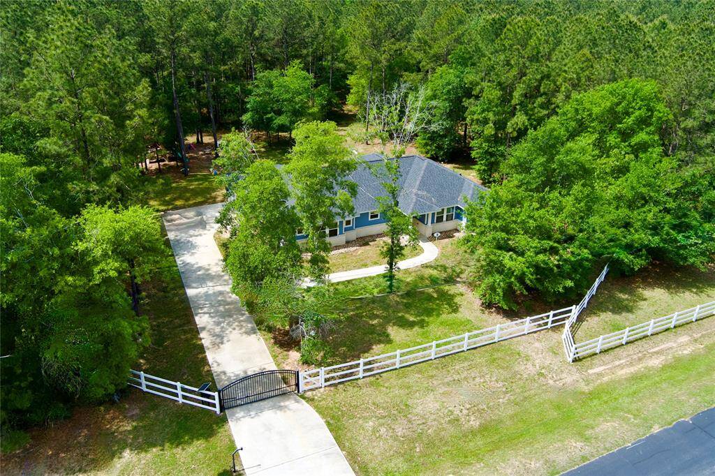 Fully fenced and gated 2 acres with beautiful trees!