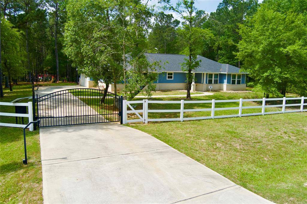 Fully fenced and gated 2 acres with beautiful trees!
