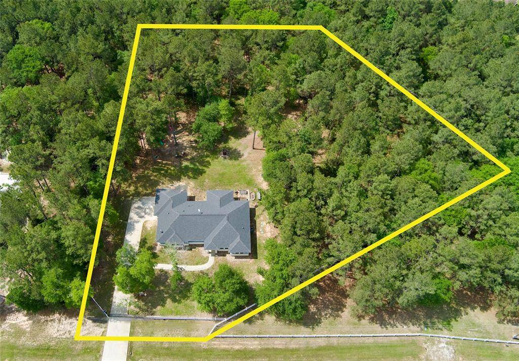 Fully fenced and gated 2 acres with beautiful trees!