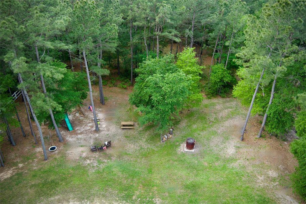 Fully fenced and gated 2 acres with beautiful trees!