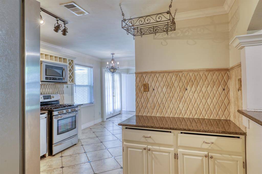 Perfect Spot for your Coffee Bar! Closeup of Harlequin Tile Backsplash.