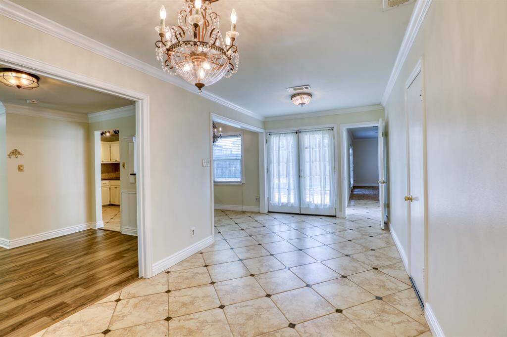 Gorgeous Chandeliers, Intricate Tile Work and French Doors to the Patio