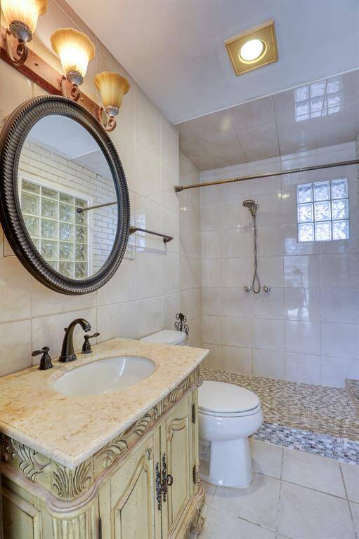 Huge Tiled Shower with Glass block