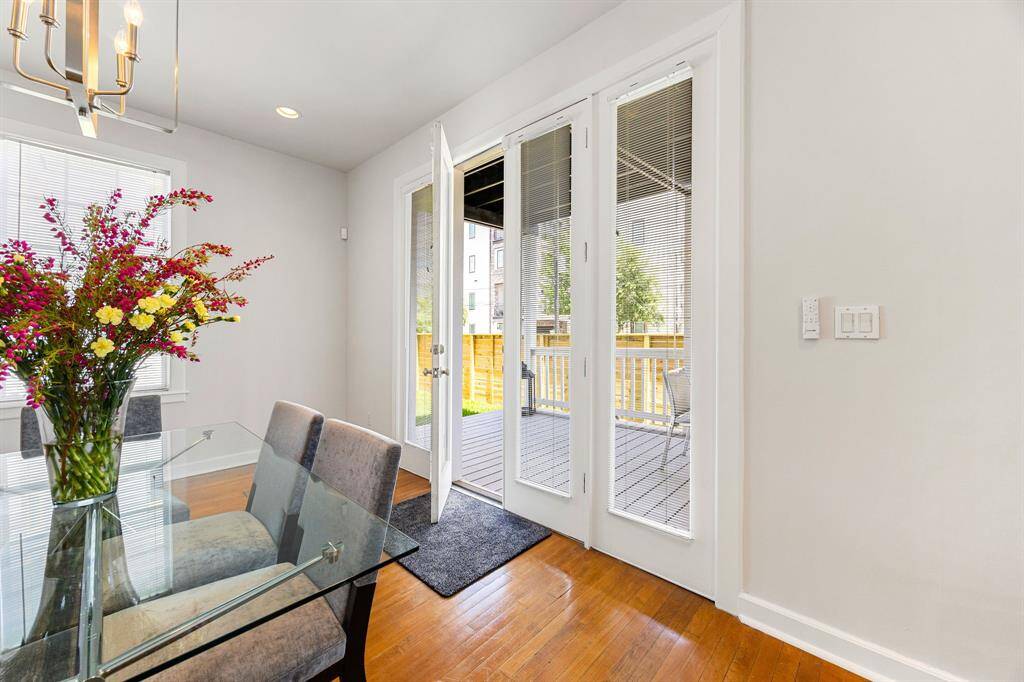 Access the large first-floor patio and fenced back yard from the beautiful French doors.