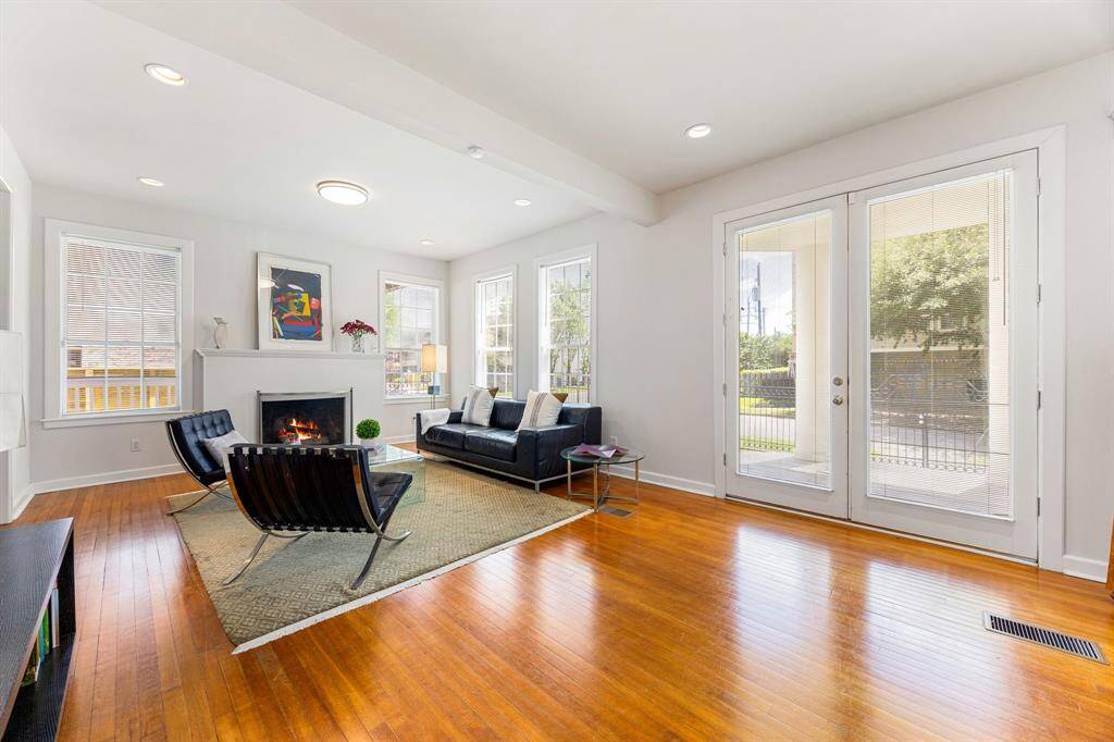 Double-doored front entrance with gleaming hard-wood flooring compliment this 1930's home beautifully.
