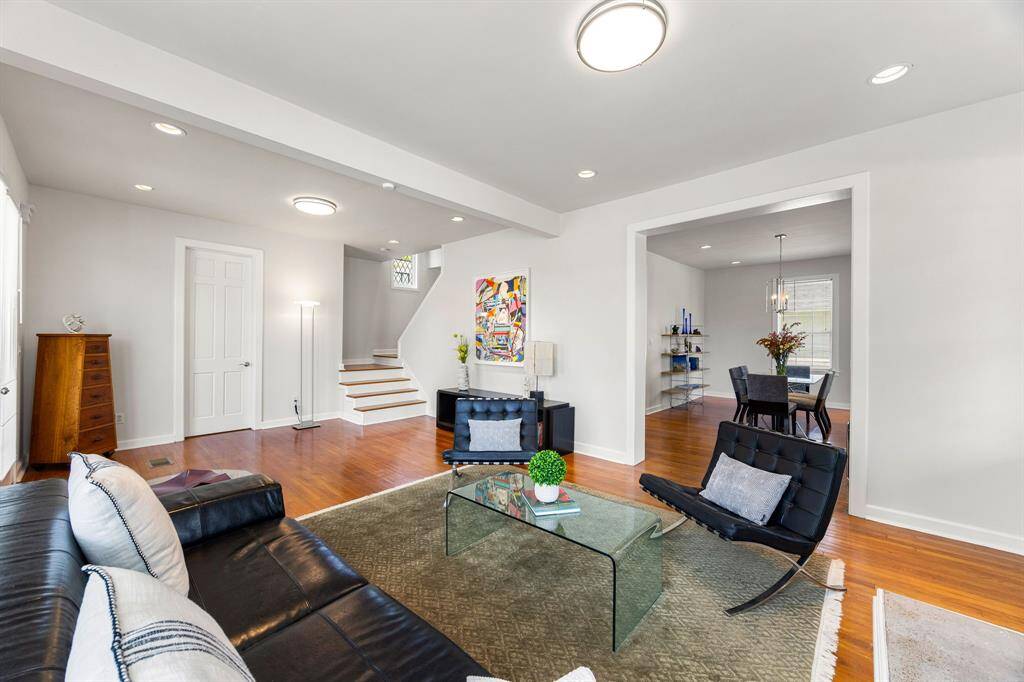 The living area effortlessly flows into the dining room, creating an open and inviting space.