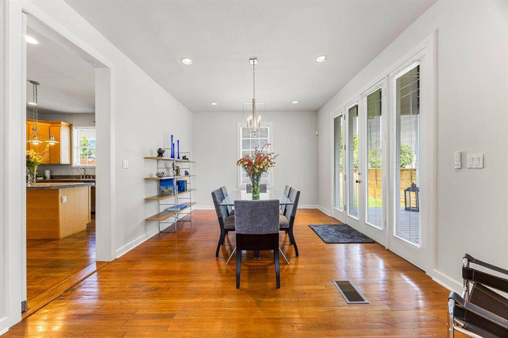 Notice the beautiful hardwood floors throughout the home and natural light flooding through the large windows.