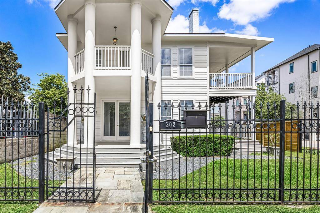Elegant columns great your guests with a welcoming front porch entrance. The property is completely fenced.