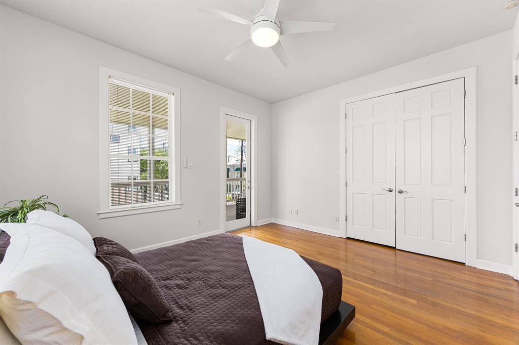 Spacious primary bedroom featuring a generous closet with built-in shelves for effortless organization along with outdoor patio access.
