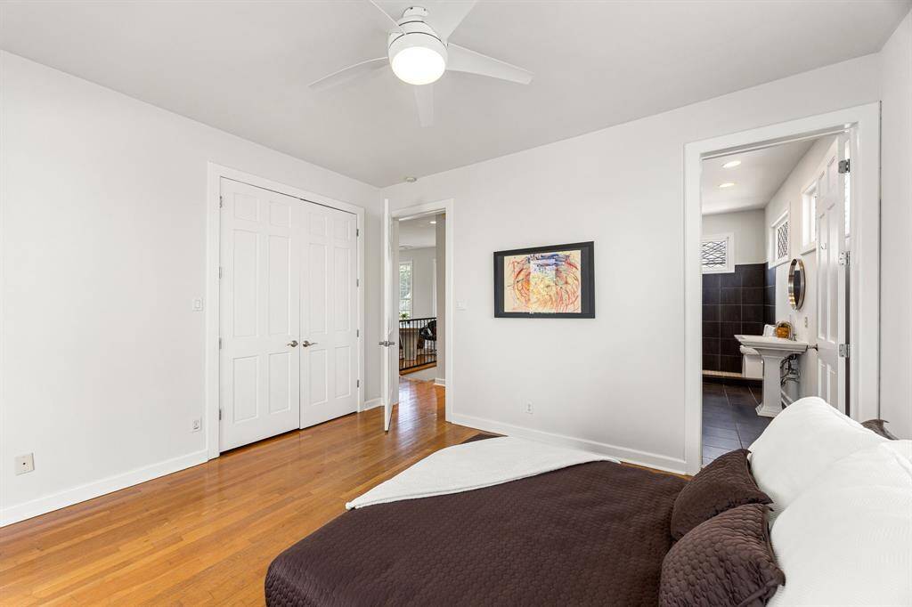 Another angle of the expansive en-suite primary bedroom—showcasing comfort, space, and style in every corner.