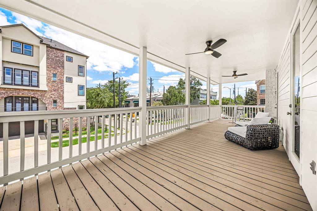 Top side balcony with access to primary bedroom and secondary upstairs bedroom.