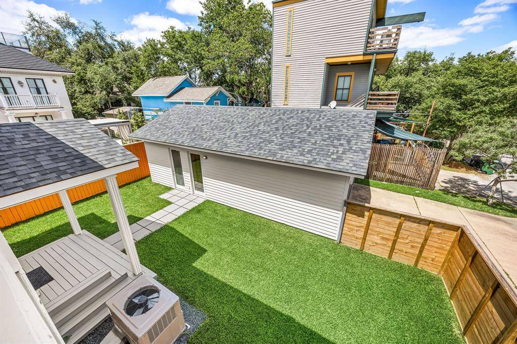 Fully sodded back yard with walkway to the oversized 2 car garage and additional room (currently an exercise room)