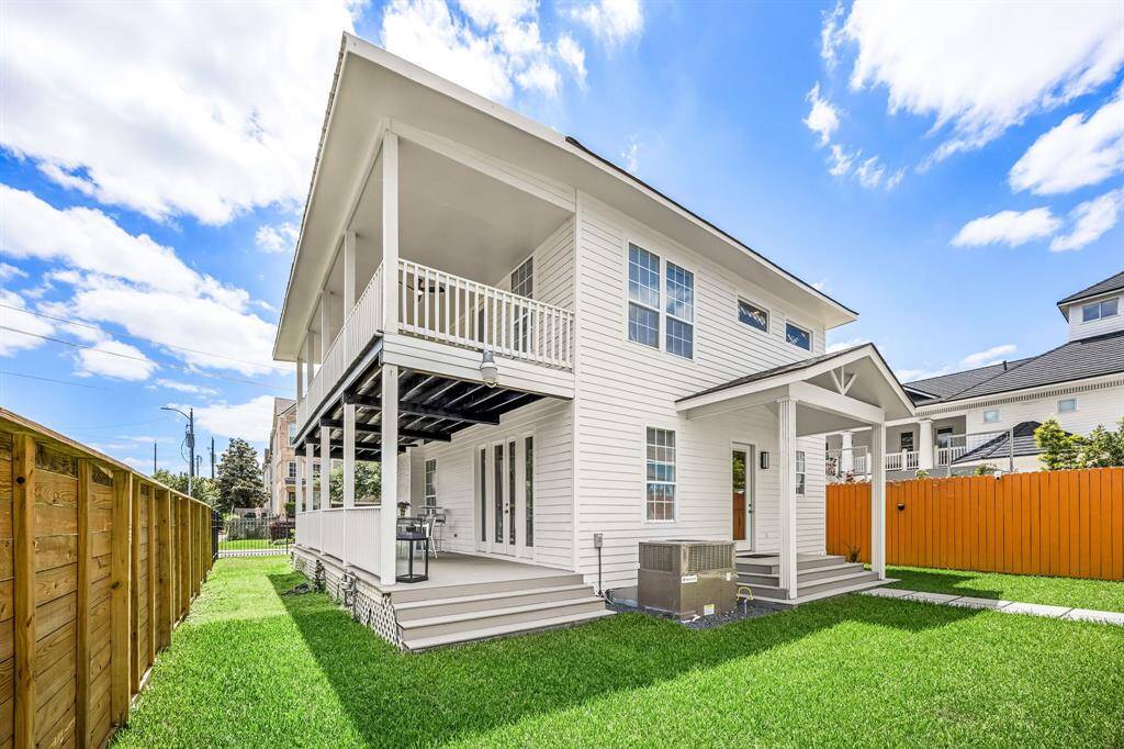 View of side yard and back yard.