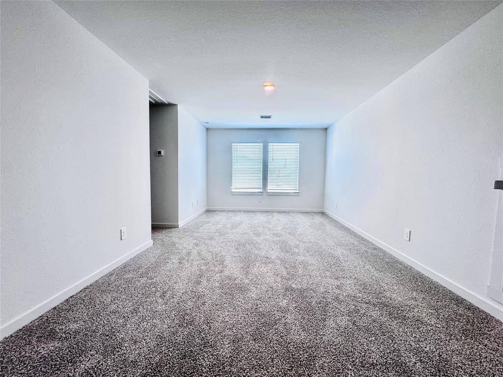Expansive loft ideal for a versatile second living area.