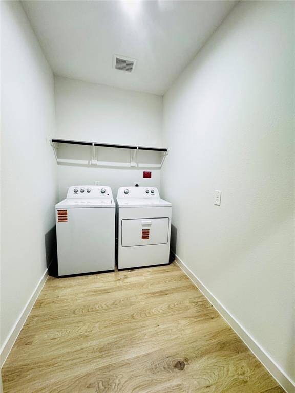 Laundry Room: Equipped with modern washer and dryer.