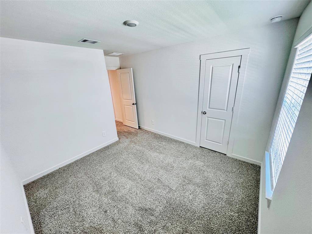 Three inviting bedrooms offer comfort and style.