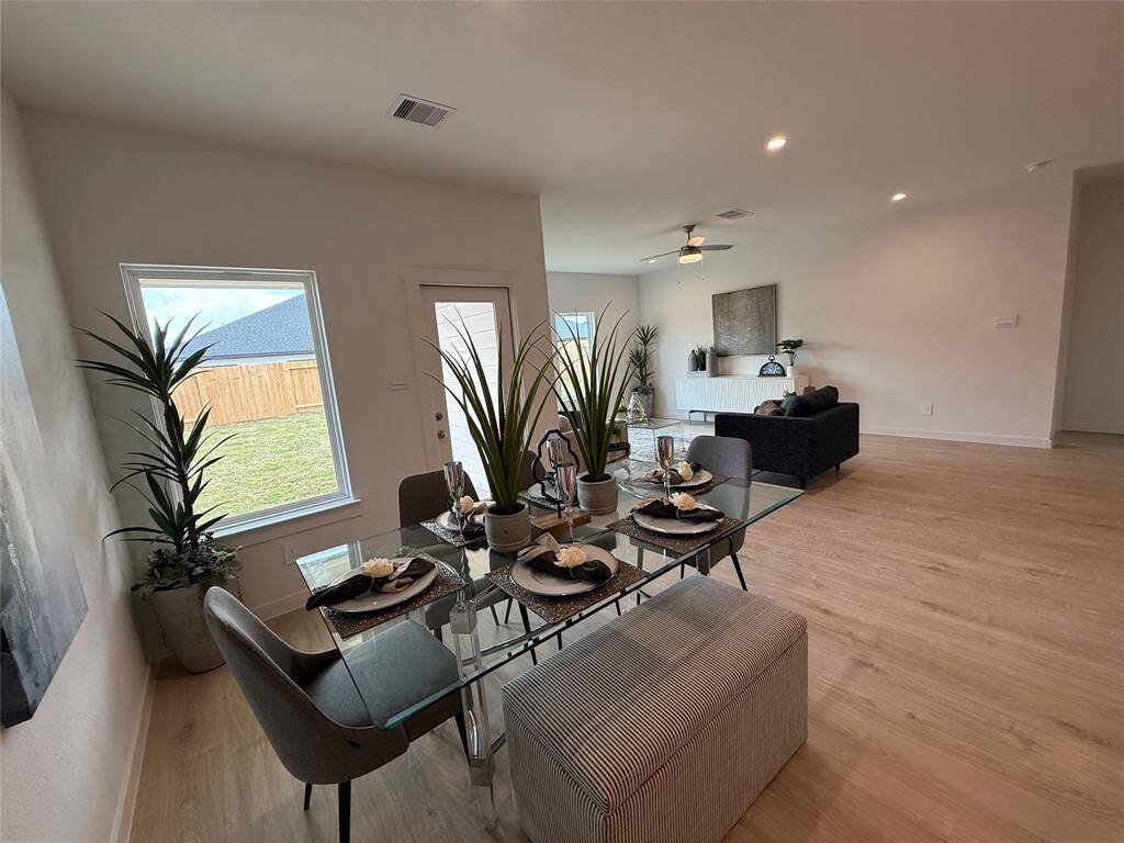Cozy and inviting bedroom with natural light and plush carpeting, perfect for relaxation.