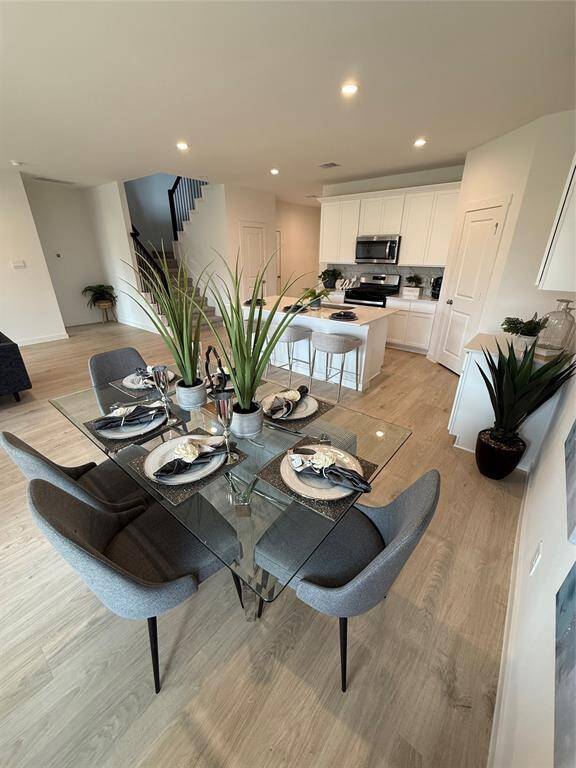 Spacious master bedroom with plush carpeting, modern decor, and an en-suite bathroom for ultimate comfort and convenience.