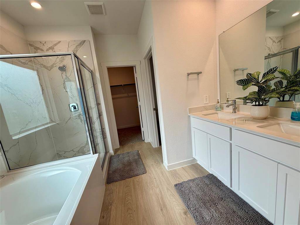 Cozy and bright third bedroom with plush carpeting and a large window for natural light. Perfect for guests or a home office.