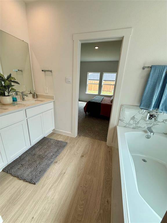 Cozy and versatile fourth bedroom, perfect for a child's room or creative space, featuring plush carpeting and ample natural light.