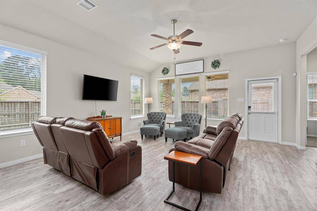 Bright and inviting, this expansive living area is bathed in natural light.