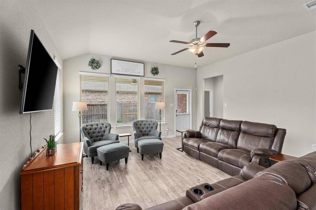Enjoy seamless access to the primary suite from the inviting living area.