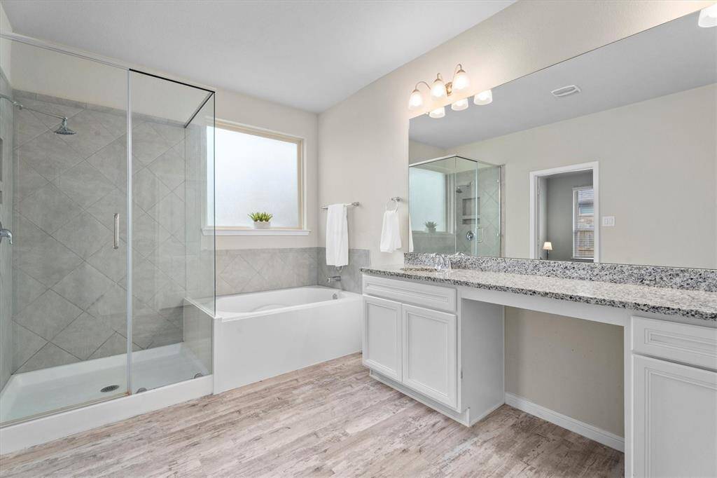 Indulge in the relaxing soaking tub or enjoy the refreshing rain head shower.